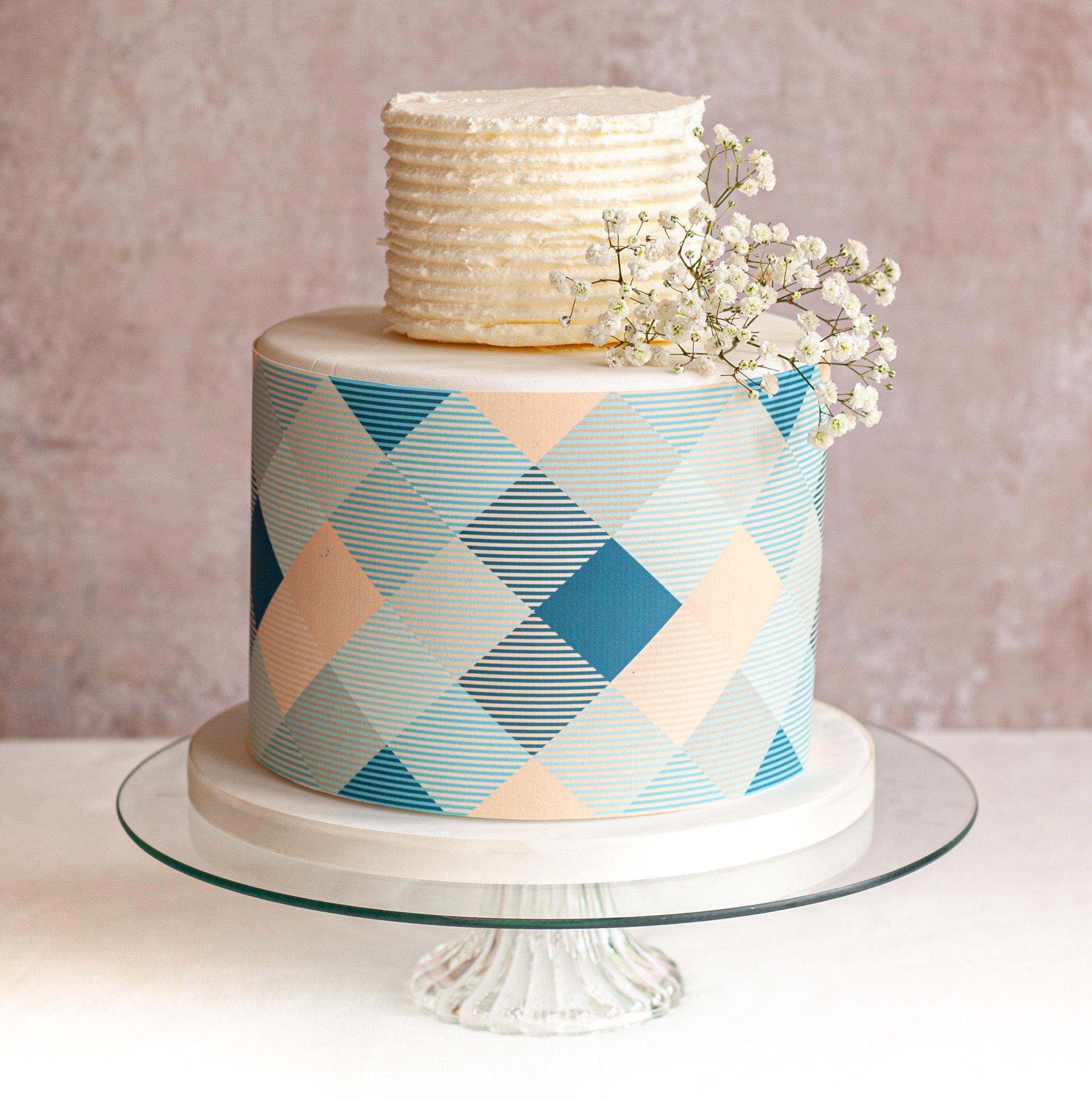 Large celebration cake with blue check cake wrap