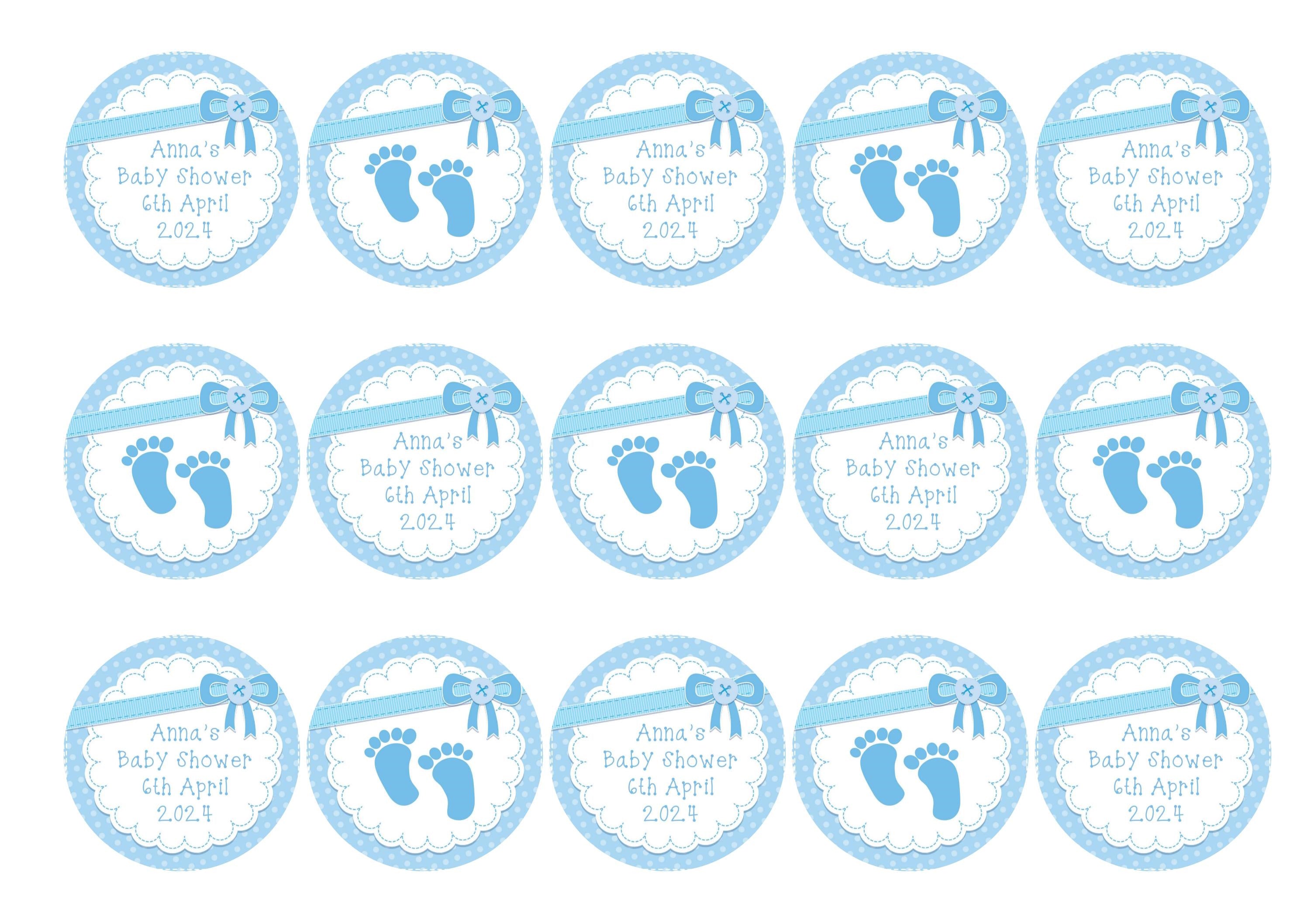 15 printed cupcake toppers with a blue bow design, personalised for a baby shower