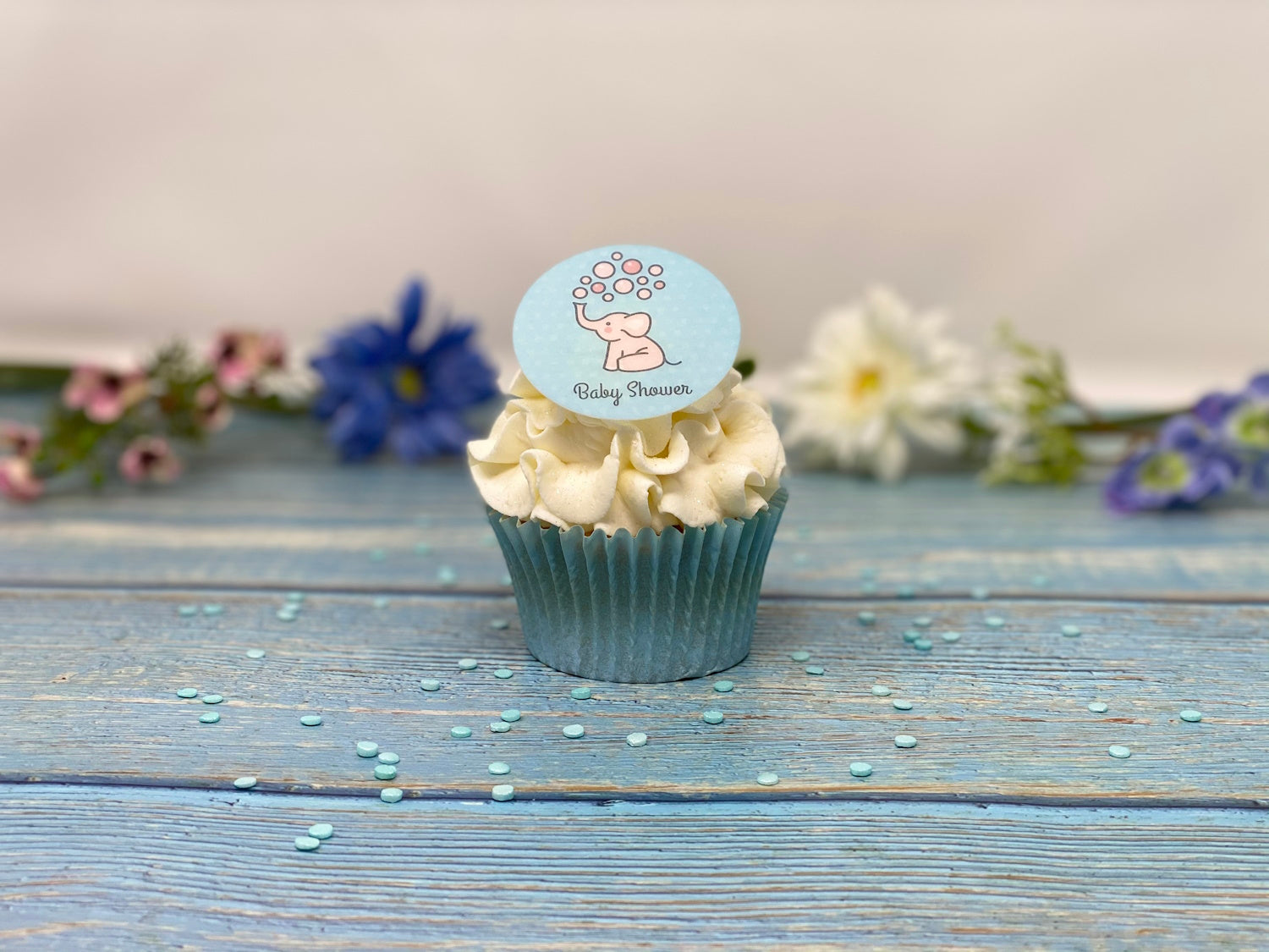 Edible cupcake toppers for a baby shower with a cute elephant design