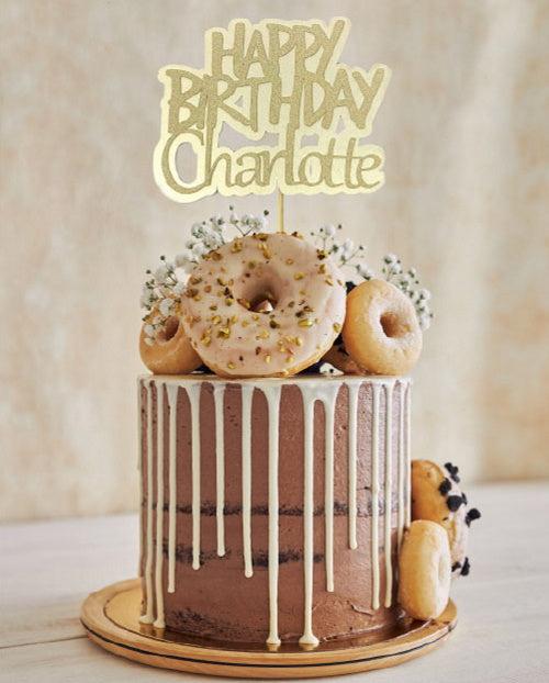 Gold Glitter Cake Topper personalised for a birthday on a doughnut chocolate drip cake