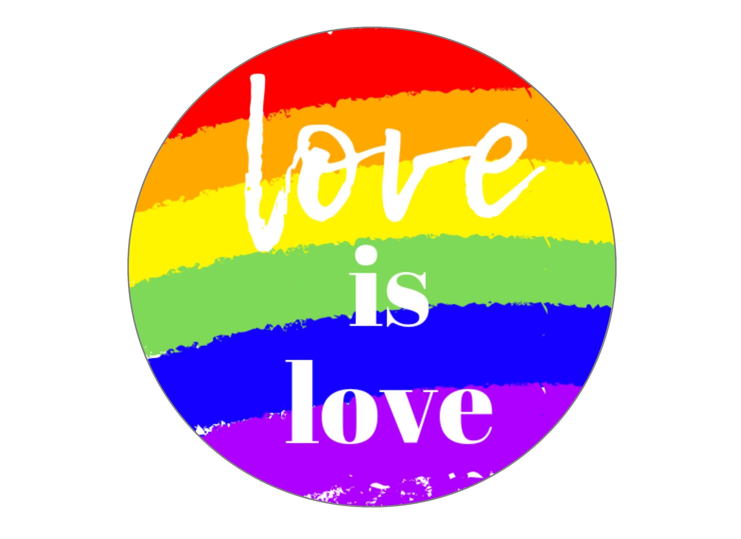 Large round cake topper with a love is love theme for LGBT Pride