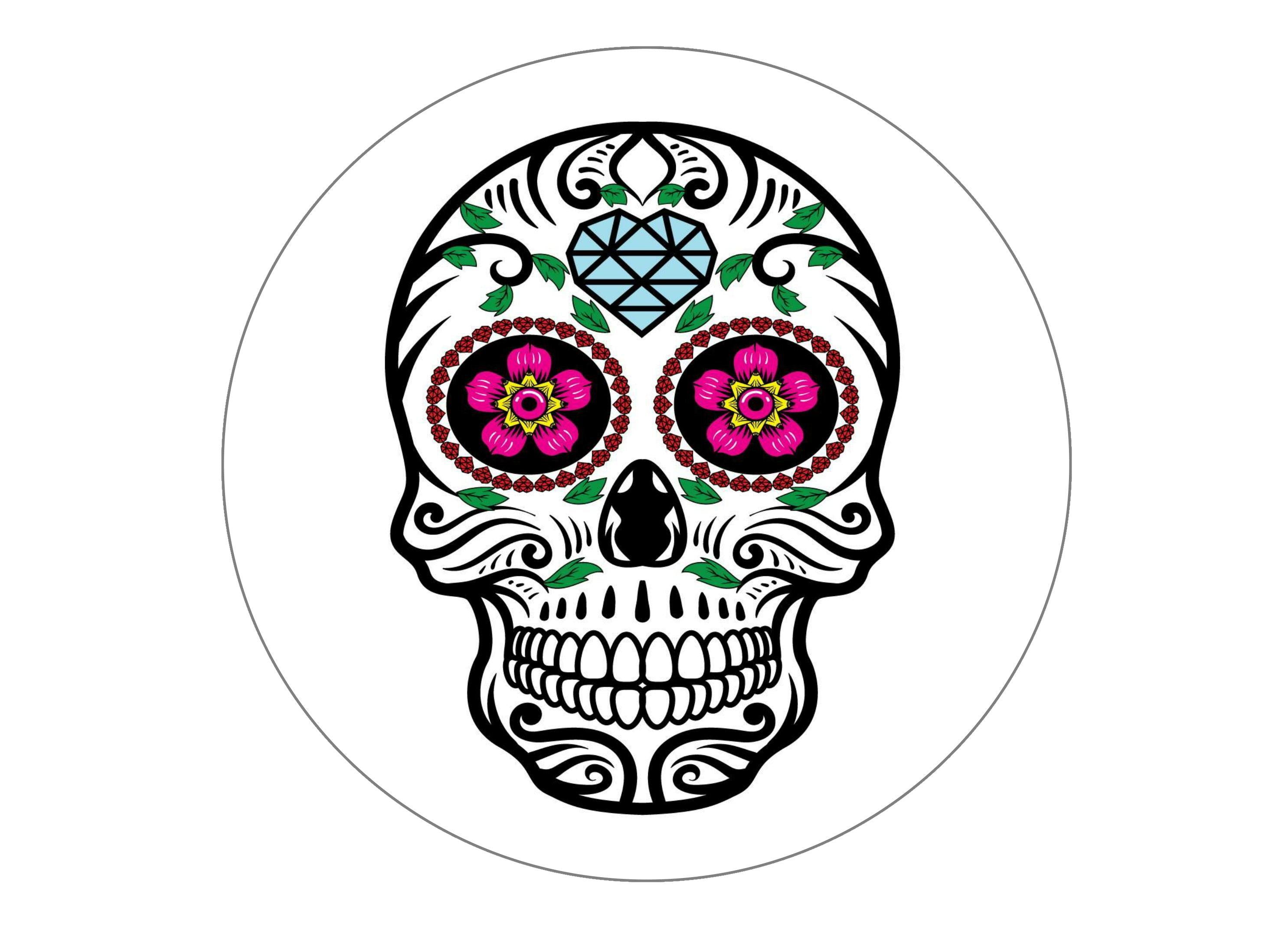 large printed cake topper with a sugar skull design